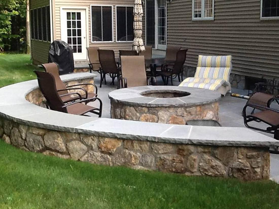 Stone retaining wall construction in residential yard